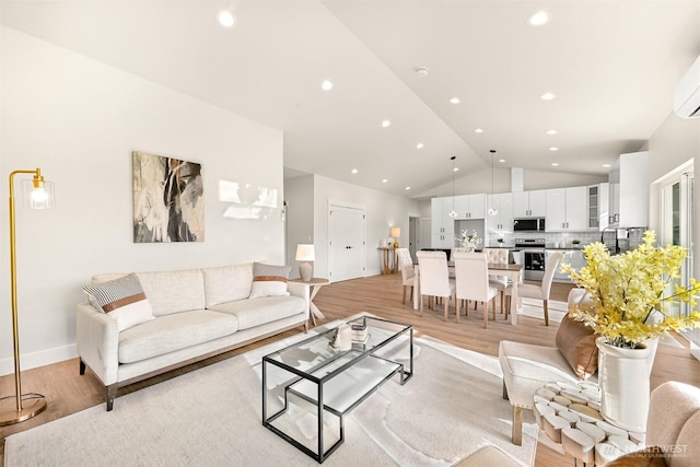 710 E 4th St, Nooksack, WA 98276 - living area with light wood-type flooring, vaulted ceiling, and recessed lighting