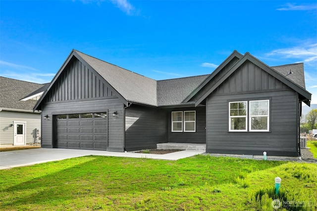 710 E 4th St, Nooksack, WA 98276 - modern farmhouse style home featuring board and batten siding, an attached garage, a front lawn, driveway, and roof with shingles