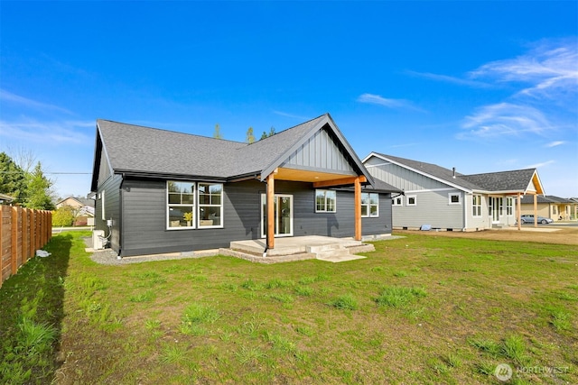 710 E 4th St, Nooksack, WA 98276 - rear view of property featuring board and batten siding, a patio, and roof with shingles