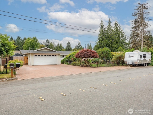 6725 Husky Way SE, Olympia, WA 98503 - view of front of home with decorative driveway and a garage