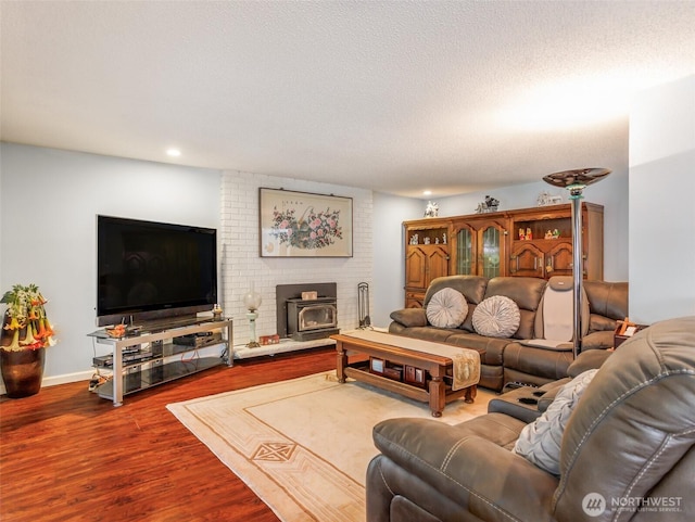 6725 Husky Way SE, Olympia, WA 98503 - living room with a wood stove, wood finished floors, and recessed lighting