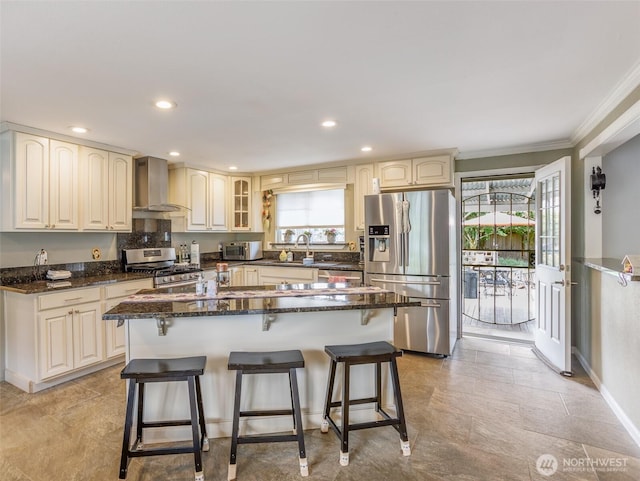 6725 Husky Way SE, Olympia, WA 98503 - kitchen with appliances with stainless steel finishes, wall chimney exhaust hood, plenty of natural light, crown molding, and a breakfast bar area
