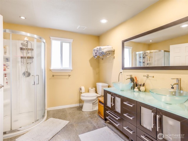 6725 Husky Way SE, Olympia, WA 98503 - full bathroom with a shower stall, double vanity, tile patterned floors, and recessed lighting