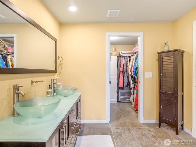 6725 Husky Way SE, Olympia, WA 98503 - full bathroom featuring double vanity, a walk in closet, and tile patterned flooring