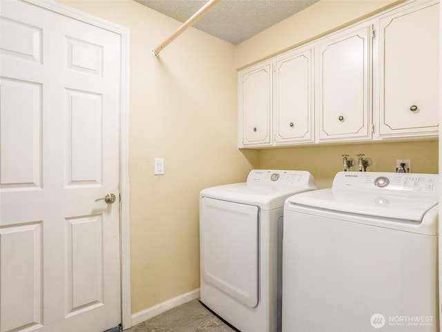 6725 Husky Way SE, Olympia, WA 98503 - laundry room with cabinet space, washing machine and clothes dryer, and a textured ceiling