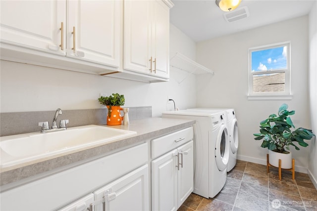 23228 SE 50th St, Issaquah, WA 98029 - laundry room featuring separate washer and dryer, cabinet space, and light stone finish flooring