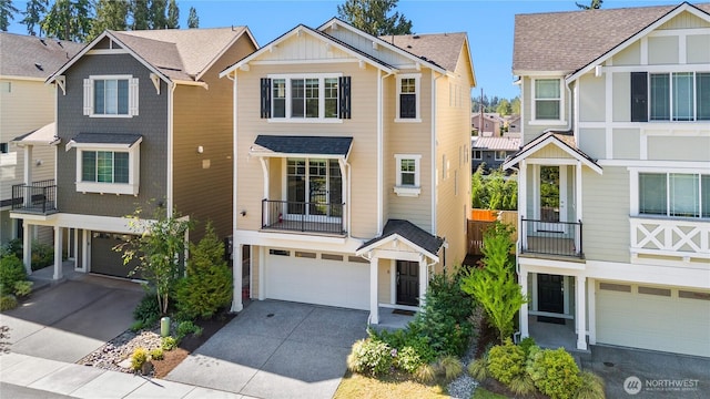 2204 176th Pl SW Unit 3, Lynnwood, WA 98037 - view of front of home with an attached garage, concrete driveway, and board and batten siding