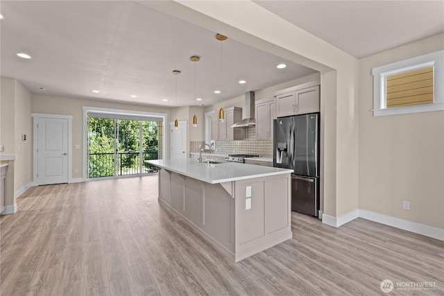2204 176th Pl SW Unit 3, Lynnwood, WA 98037 - kitchen featuring stainless steel refrigerator with ice dispenser, light countertops, light wood-style flooring, backsplash, and recessed lighting