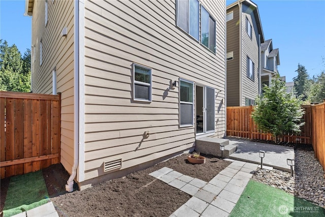 2204 176th Pl SW Unit 3, Lynnwood, WA 98037 - view of home's exterior featuring a fenced backyard