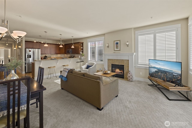 616 Glen St Unit 101, Edmonds, WA 98020 - living area with light carpet and a fireplace with flush hearth