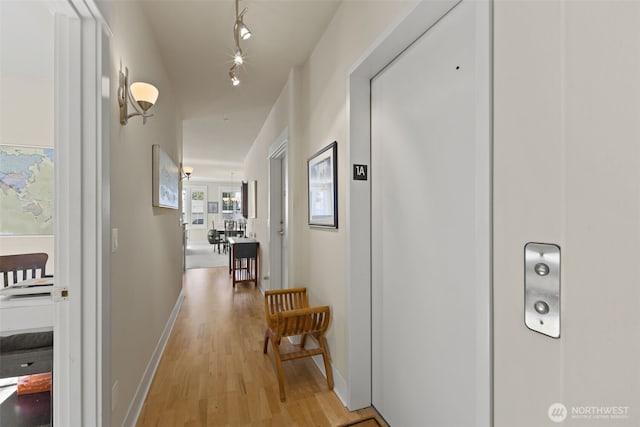 616 Glen St Unit 101, Edmonds, WA 98020 - corridor featuring light wood-style floors and baseboards