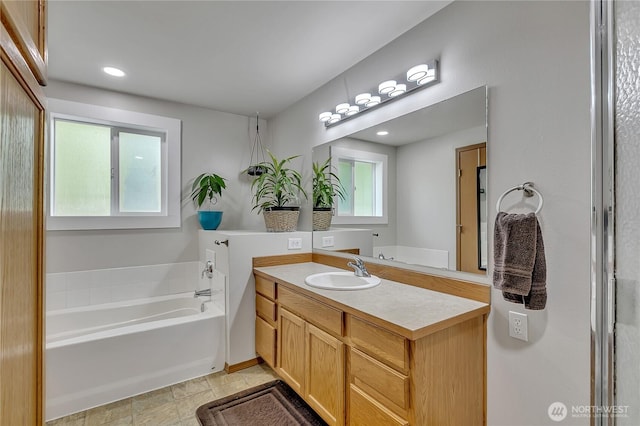 9540 El Camino Ln SE, Yelm, WA 98597 - full bath with vanity, a bath, and recessed lighting