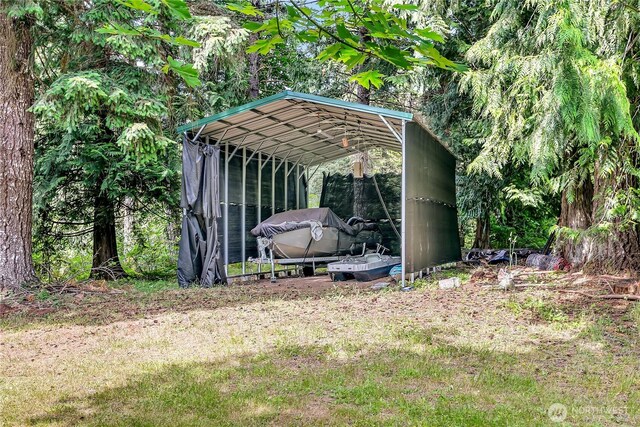 9540 El Camino Ln SE, Yelm, WA 98597 - view of outdoor structure featuring a carport