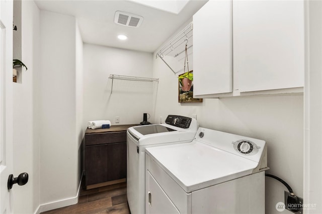 28 Lost Lake Ln, Bellingham, WA 98229 - laundry room with washing machine and clothes dryer, cabinet space, and dark wood-style flooring