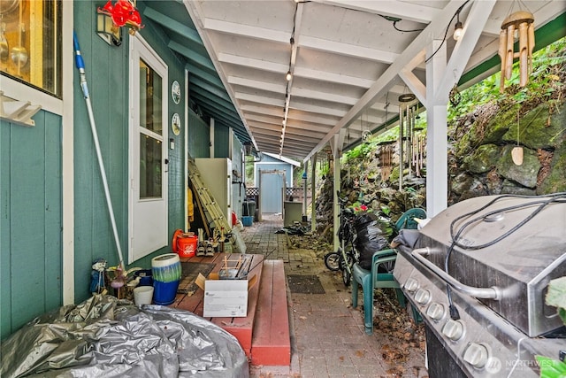 7445S Pine St, Tacoma, WA 98409 - view of patio with a storage unit and a grill
