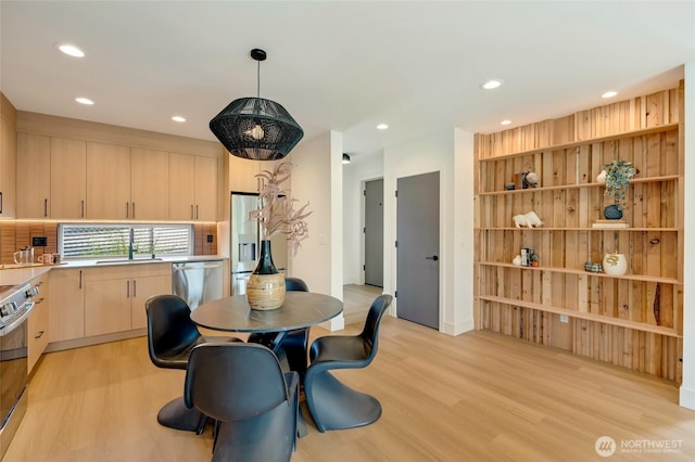 5427 25th Ave SW, Seattle, WA 98106 - dining space featuring light wood-style floors and recessed lighting