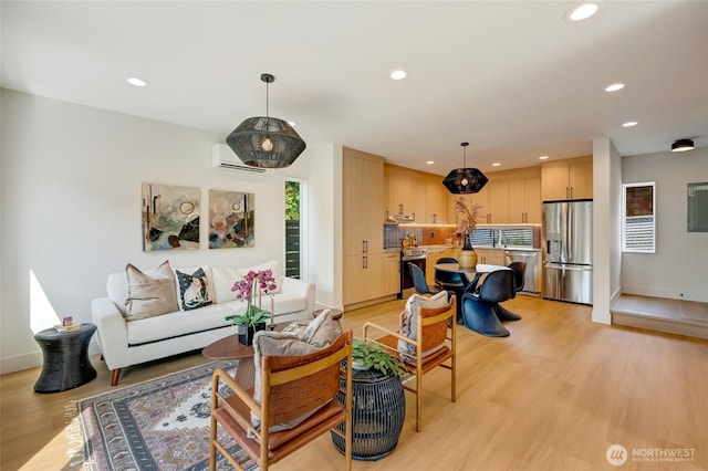 5427 25th Ave SW, Seattle, WA 98106 - living room with recessed lighting, light wood-style flooring, and a wall unit AC