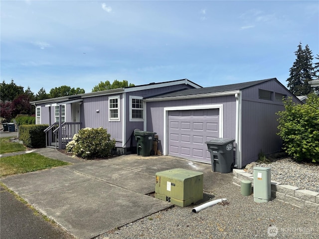 7519 18th Avenue Ct E, Tacoma, WA 98404 - view of front facade with a garage and driveway