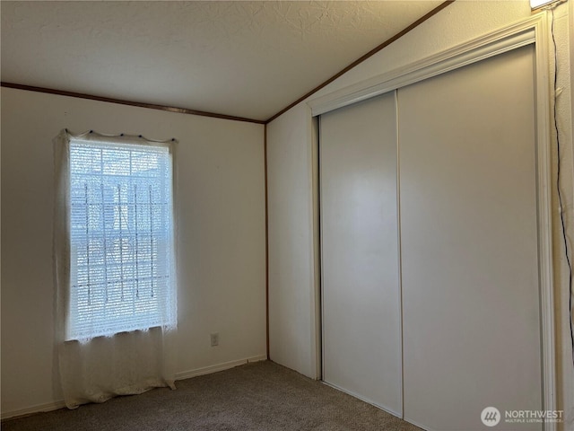 7519 18th Avenue Ct E, Tacoma, WA 98404 - unfurnished bedroom with carpet floors, a closet, and crown molding