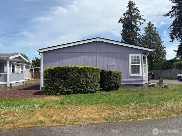 7519 18th Avenue Ct E, Tacoma, WA 98404 - view of home's exterior with crawl space and a yard
