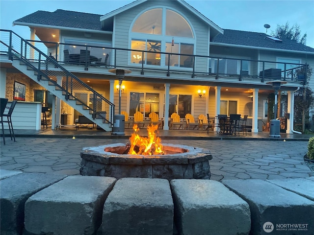 29919 39th Ave S, Roy, WA 98580 - back of property with a balcony, an outdoor fire pit, stairs, and a patio