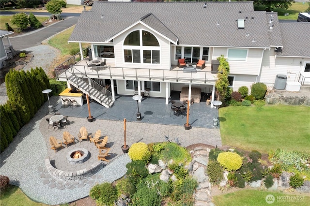 29919 39th Ave S, Roy, WA 98580 - back of house featuring an outdoor fire pit, a patio area, roof with shingles, a yard, and stairs