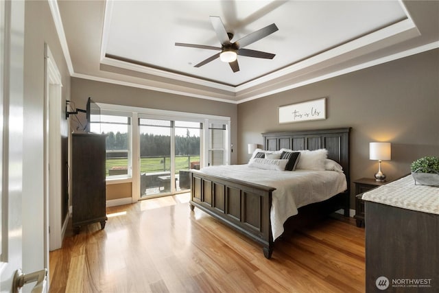 29919 39th Ave S, Roy, WA 98580 - bedroom with a tray ceiling, crown molding, access to exterior, light wood finished floors, and ceiling fan