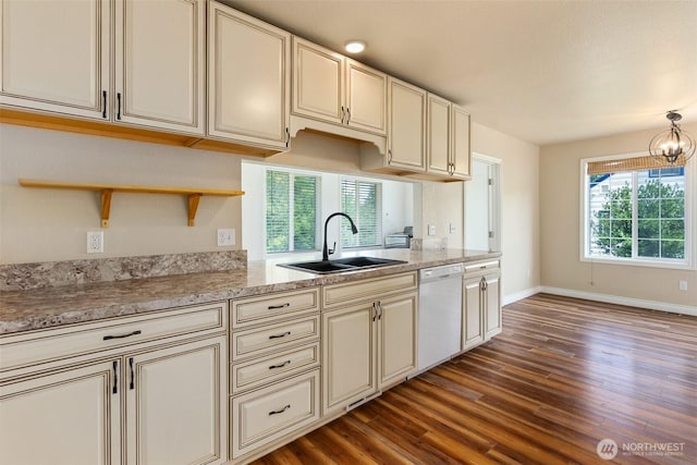 212 Euclid Ave, Shelton, WA 98584 - kitchen with cream cabinets, dark wood-style flooring, dishwasher, a chandelier, and open shelves