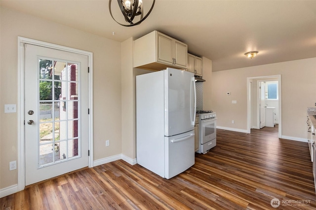 212 Euclid Ave, Shelton, WA 98584 - kitchen featuring white appliances, dark wood-style floors, a chandelier, and under cabinet range hood