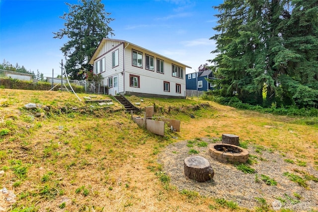 212 Euclid Ave, Shelton, WA 98584 - rear view of house featuring a fire pit and board and batten siding