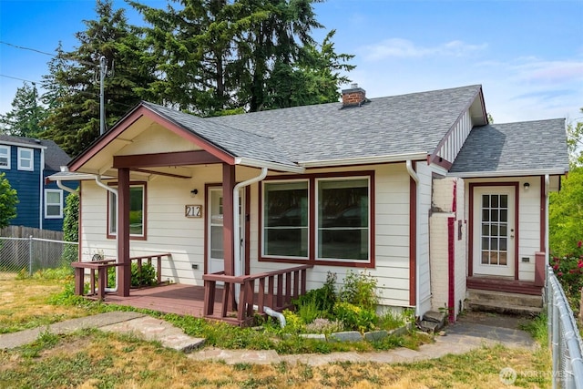 212 Euclid Ave, Shelton, WA 98584 - view of front of home featuring roof with shingles, a chimney, and entry steps