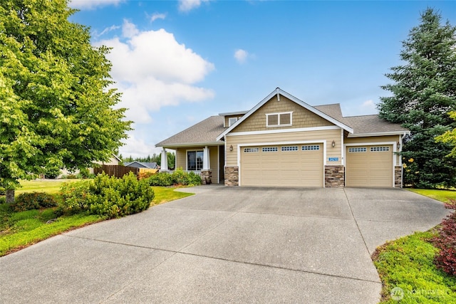 24210 Nookachamp Hills Dr, Mount Vernon, WA 98274 - craftsman house featuring stone siding, an attached garage, and concrete driveway