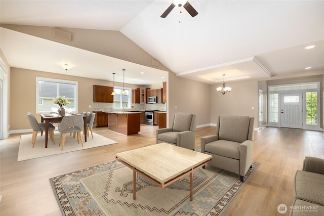 24210 Nookachamp Hills Dr, Mount Vernon, WA 98274 - living room featuring healthy amount of natural light, light wood-style floors, lofted ceiling, a chandelier, and recessed lighting