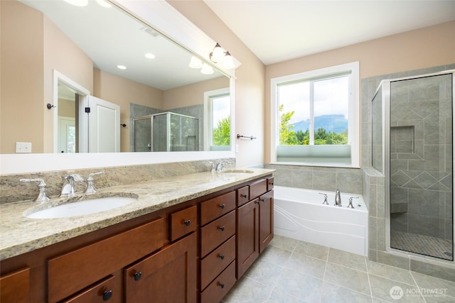 24210 Nookachamp Hills Dr, Mount Vernon, WA 98274 - full bathroom with double vanity, a stall shower, a garden tub, and tile patterned flooring
