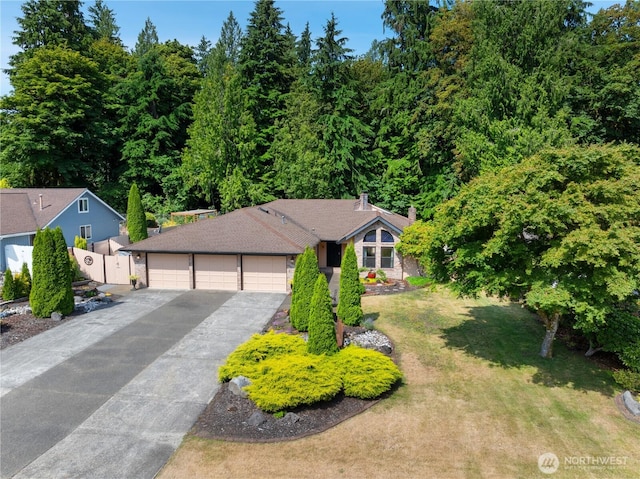 6425 Miner Dr SW, Tumwater, WA 98512 - view of front of home featuring asphalt driveway and an attached garage