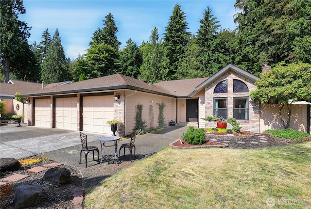 6425 Miner Dr SW, Tumwater, WA 98512 - ranch-style home featuring brick siding, a front lawn, and a garage
