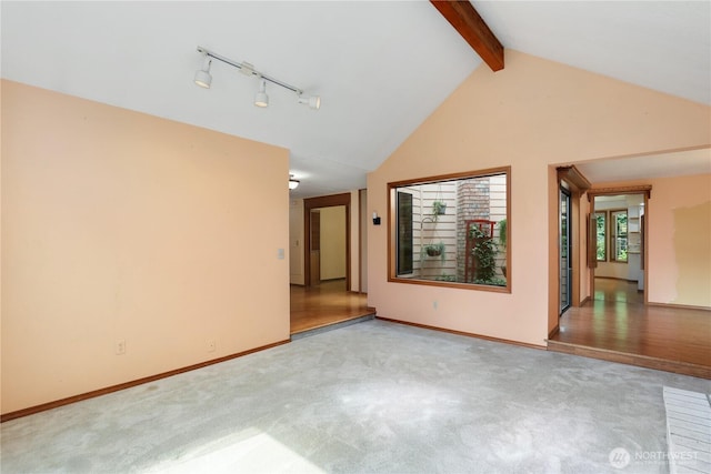 6425 Miner Dr SW, Tumwater, WA 98512 - unfurnished room with beamed ceiling, light carpet, and high vaulted ceiling