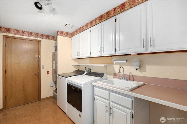 6425 Miner Dr SW, Tumwater, WA 98512 - washroom featuring separate washer and dryer and cabinet space