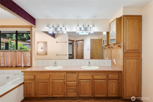 6425 Miner Dr SW, Tumwater, WA 98512 - full bathroom featuring double vanity, a garden tub, and backsplash
