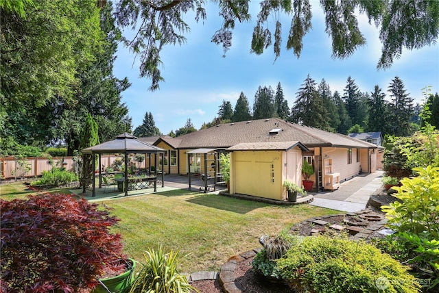 6425 Miner Dr SW, Tumwater, WA 98512 - rear view of house with a gazebo, a shed, and a patio
