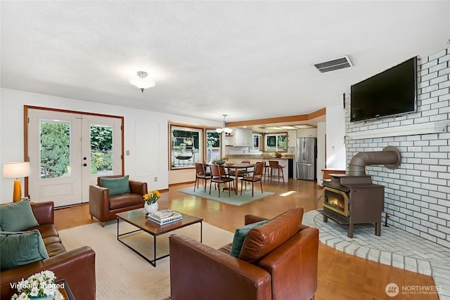 6425 Miner Dr SW, Tumwater, WA 98512 - living room with healthy amount of natural light and a wood stove