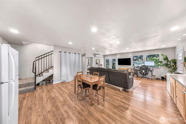 2927 Youngs Rd, Custer, WA 98240 - dining room with recessed lighting, light wood finished floors, an AC wall unit, and stairs