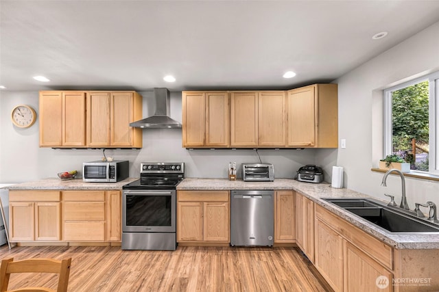 2927 Youngs Rd, Custer, WA 98240 - kitchen with stainless steel appliances, light brown cabinets, wall chimney exhaust hood, light wood-style floors, and recessed lighting