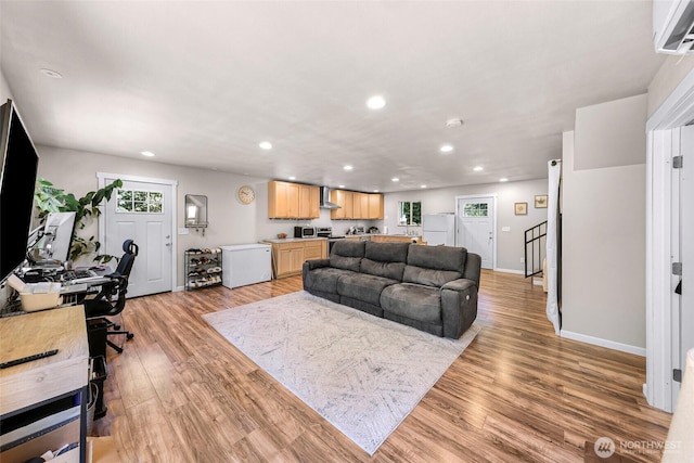 2927 Youngs Rd, Custer, WA 98240 - living room with recessed lighting, a wall unit AC, and light wood-style floors