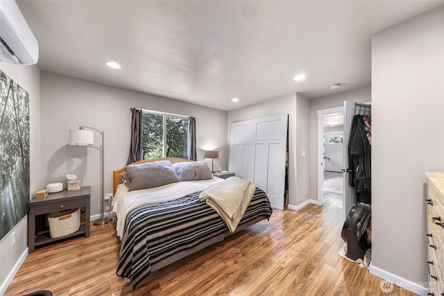 2927 Youngs Rd, Custer, WA 98240 - bedroom with a wall unit AC, light wood-style flooring, recessed lighting, and a closet