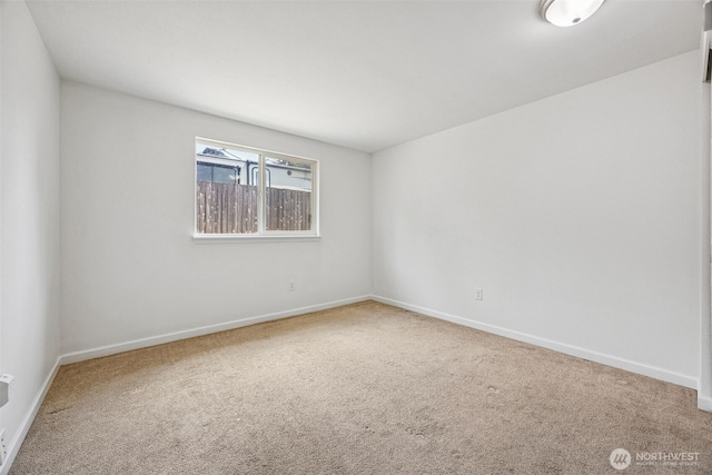 12411 134th St E, Puyallup, WA 98374 - spare room featuring carpet floors and baseboards