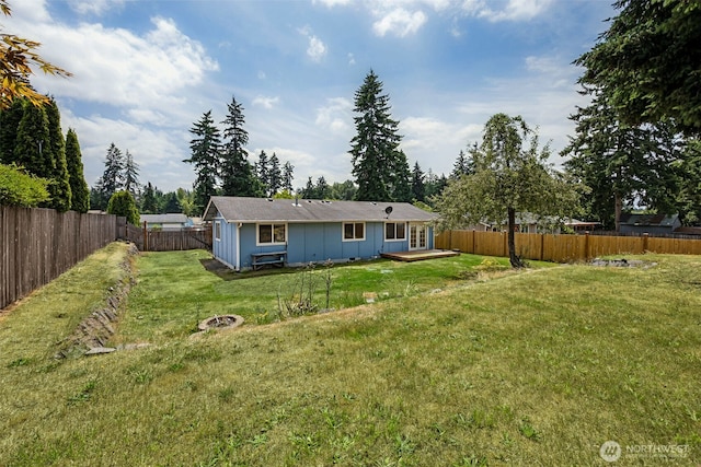 12411 134th St E, Puyallup, WA 98374 - back of house with board and batten siding and a fenced backyard