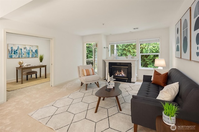 4535 Providence Point Pl SE Unit 202, Issaquah, WA 98029 - living area featuring light colored carpet and a fireplace with flush hearth