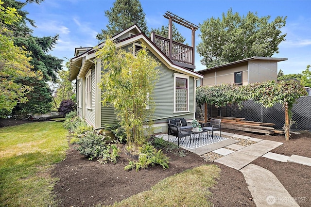 734 N 75th St, Seattle, WA 98103 - back of property featuring a patio and an outdoor living space