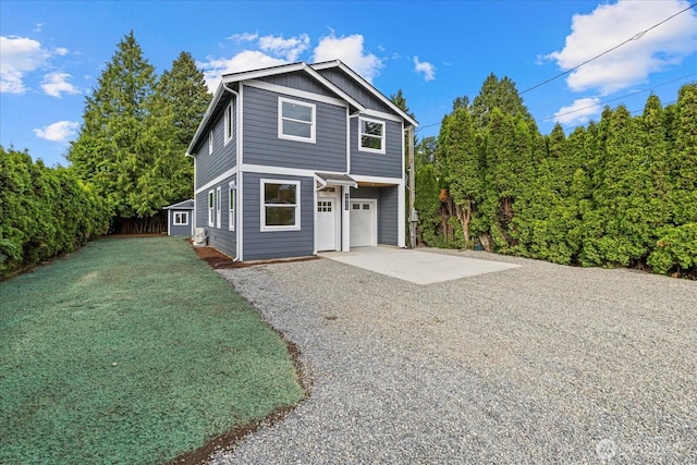 4955 Henley St, Blaine, WA 98230 - view of front facade with driveway, an attached garage, and board and batten siding